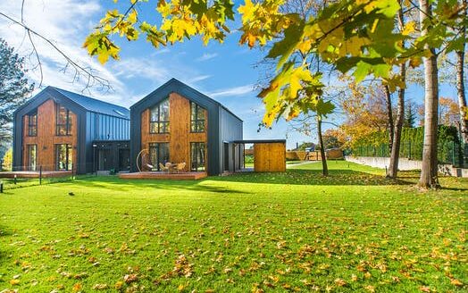 Modern eco friendly house with green area in front