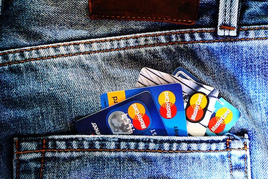 A number of credit cards sticking out of the back pocket of jeans