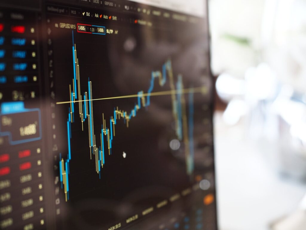 Computer monitor with stocks and shares price movements graph