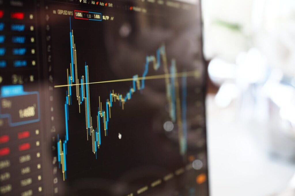 Computer monitor with stocks and shares price movements graph