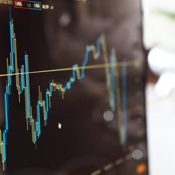 Computer monitor with stocks and shares price movements graph