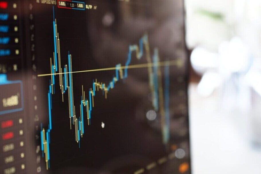 Computer monitor with stocks and shares price movements graph